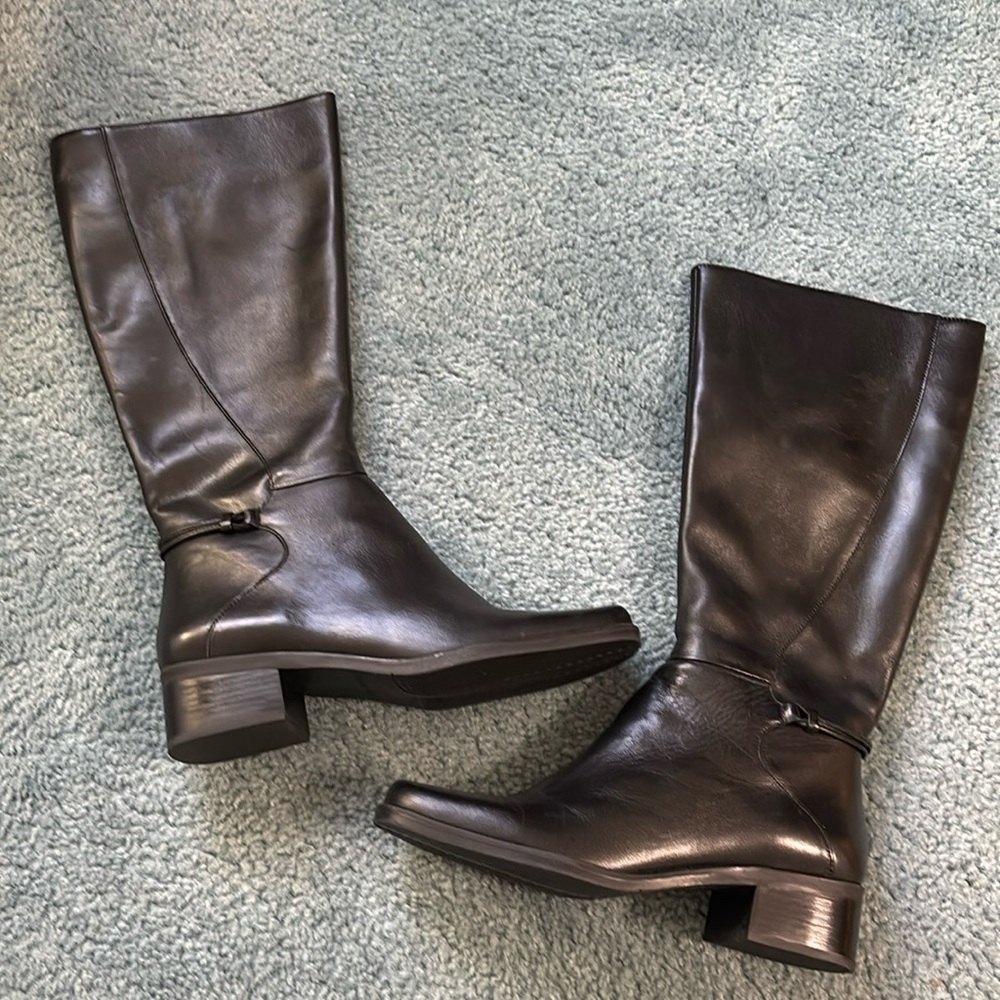 Naturalized BNWOT knee high black leather boots. Never worn. With box. Size 7.